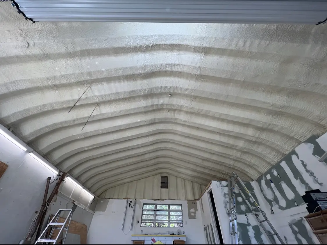 Spray polyurethane foam applied to the underside of a metal roof deck in Arcadia